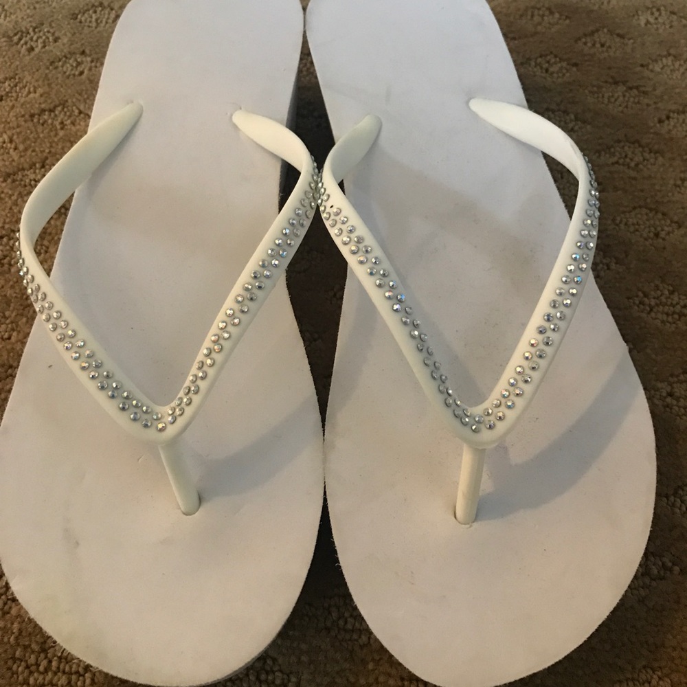 White wedge flip flops